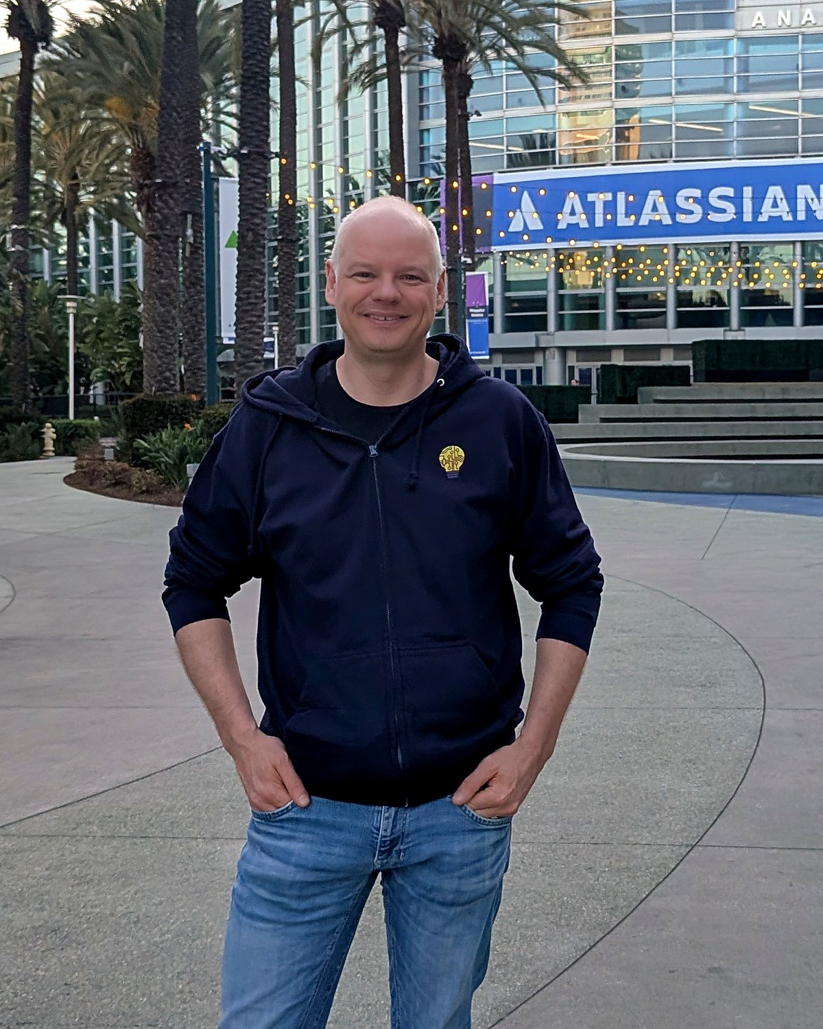 Mark Rekveld, founder of Marvelution, in front of the Atlassian banner at the Anaheim Convention Center